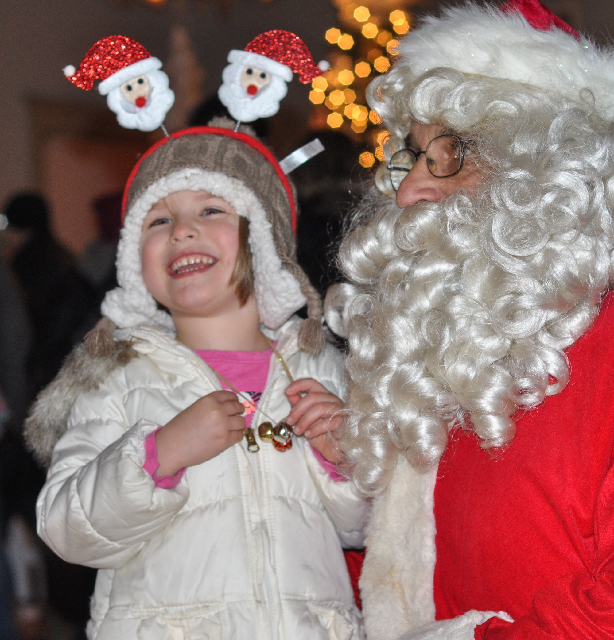 Harper Lyman-Yelle ,4, of Halifax laughs as Santa tries to guess what she wants for Christmas during the Holidays in Halifax on Dec. 10.